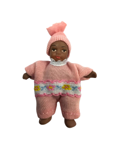 Baby In Pink Romper and Hat