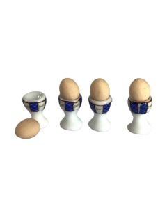 EM6799 - Four blue and white eggcups with eggs