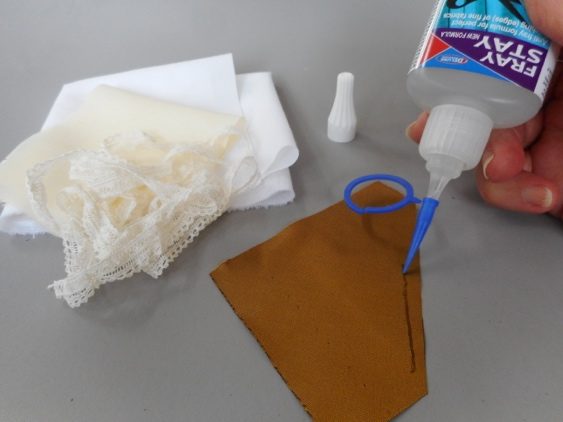 Applying a thin line of Fray Stay around the edge of a silk pattern piece with the fine-tip applicator